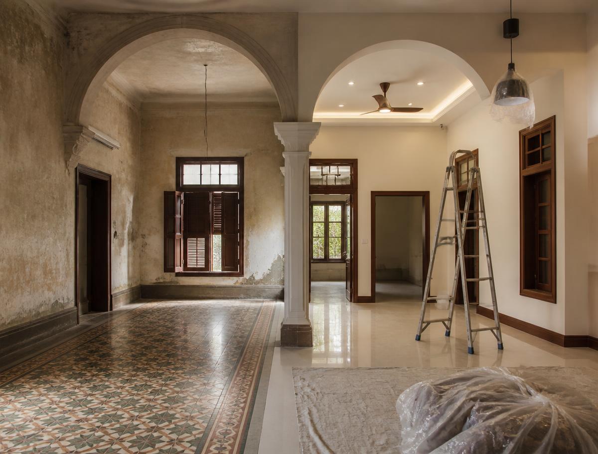 Older Indian home mid-renovation where original mosaic tile meets freshly finished walls